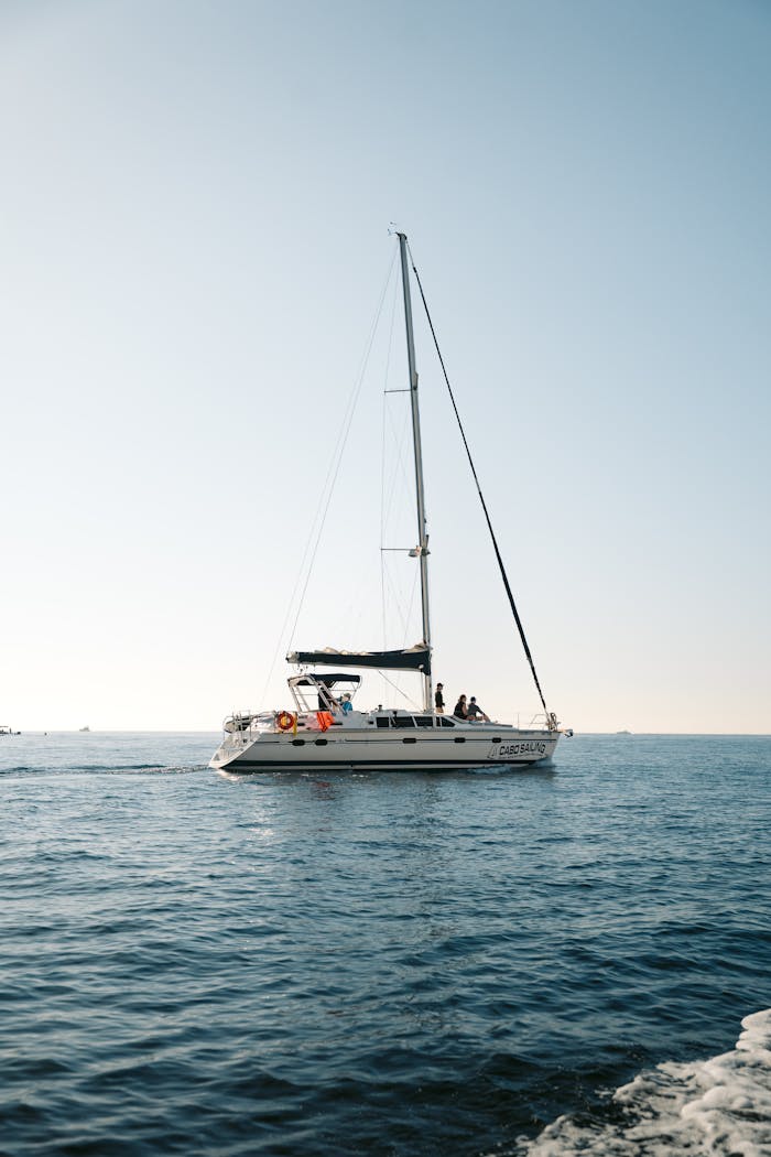 A serene sailboat journey in Baja California Sur during a sunny day on the ocean.